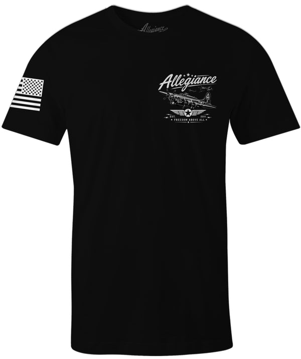 A black short-sleeve t-shirt with a white graphic print on the left chest featuring a vintage airplane and the word 'Allegiance', along with a distressed white American flag graphic on the right sleeve.